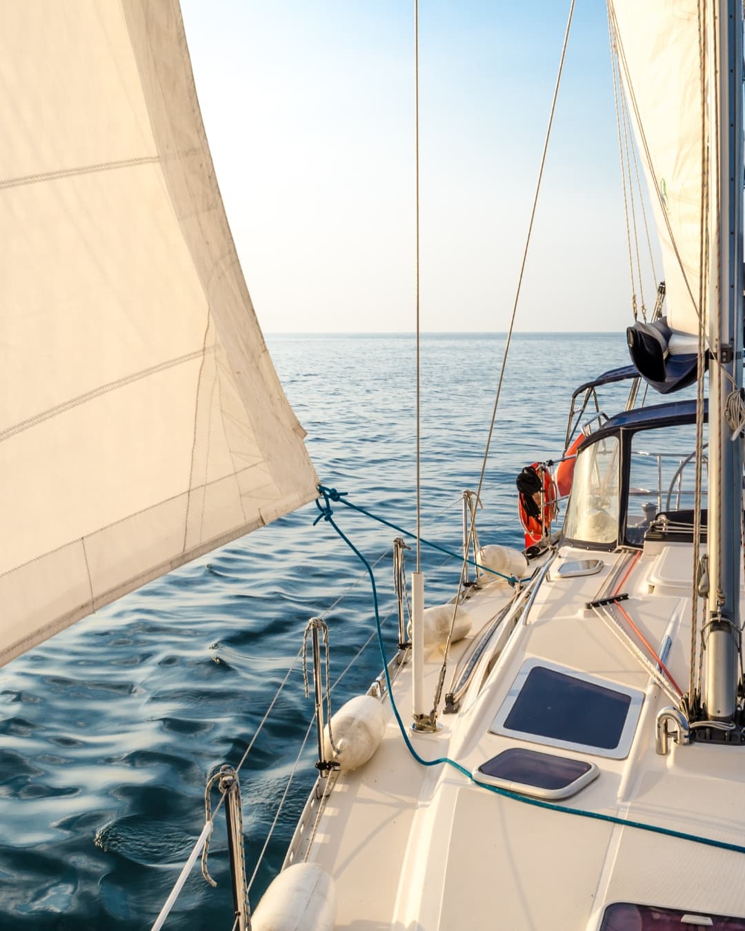 Guests enjoying a summer sailing adventure on a yacht.